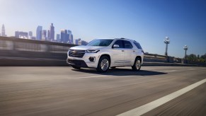 A 2023 Chevrolet Traverse driving on a highway.
