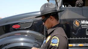 Highway Patrol issuing a truck emissions citation