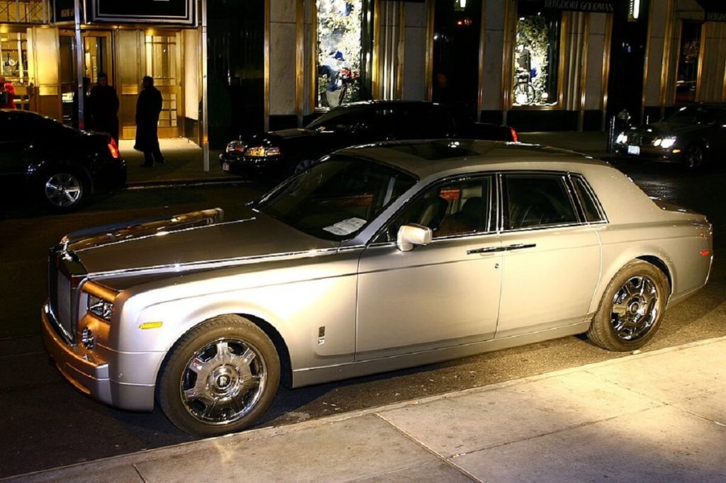 A Rolls-Royce Phantom parks next to Donald Trump's tower in New York.