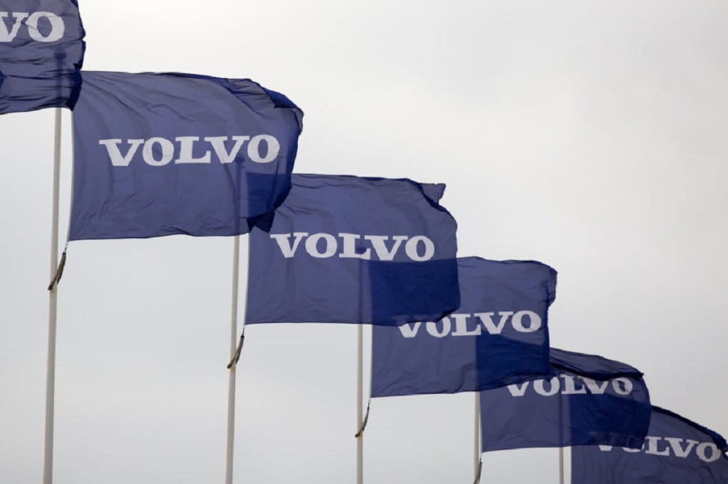 Volvo flags wave at one of the lots belonging to the car brand.  