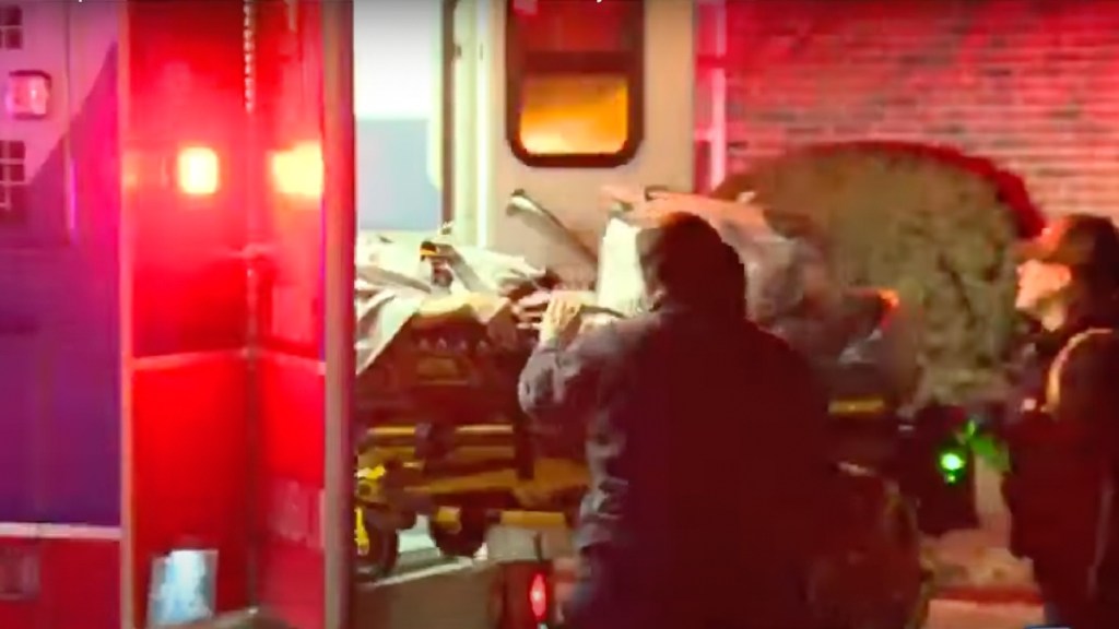 Woman placed in an ambulance after Ford Explorer car crash knocked her off the bed