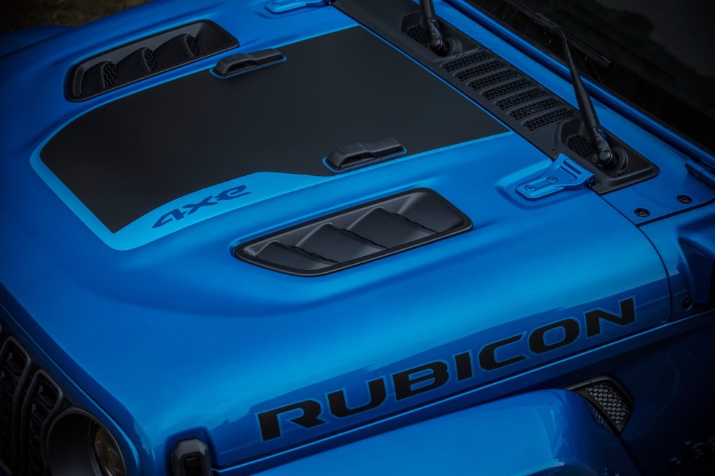 Close up shot of the hood of a blue Jeep Wrangler Rubicon 4xe. 