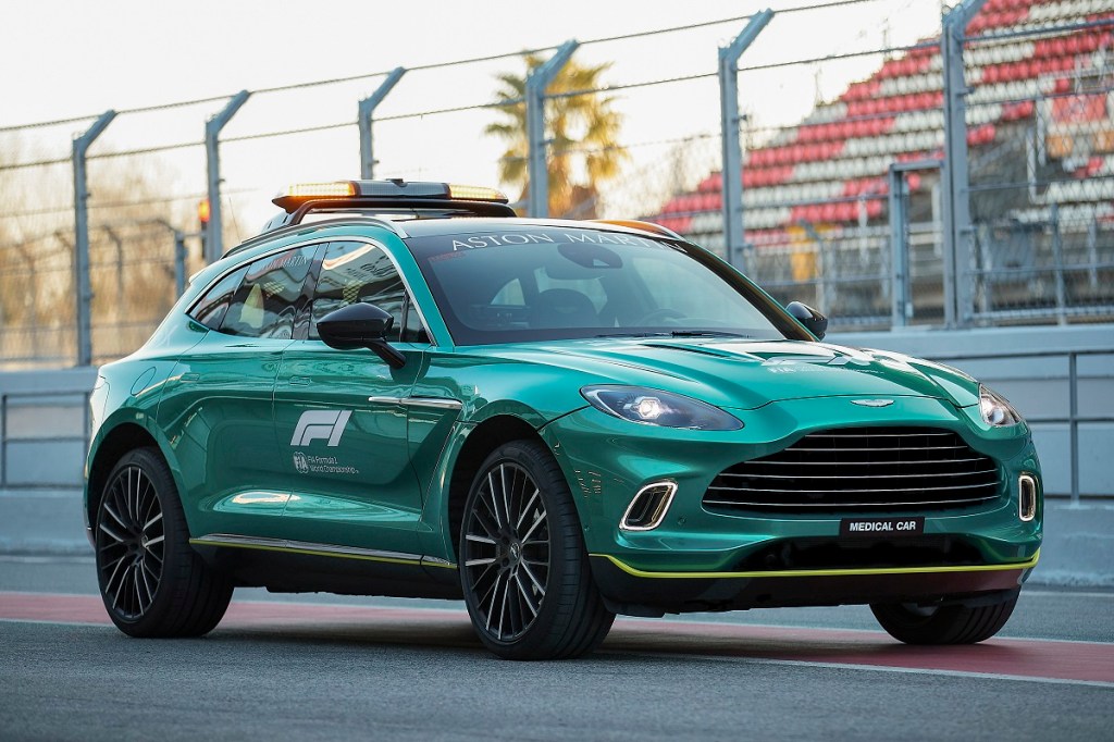 The 2023 Aston Martin DBX Formula 1 medial car in green on a track
