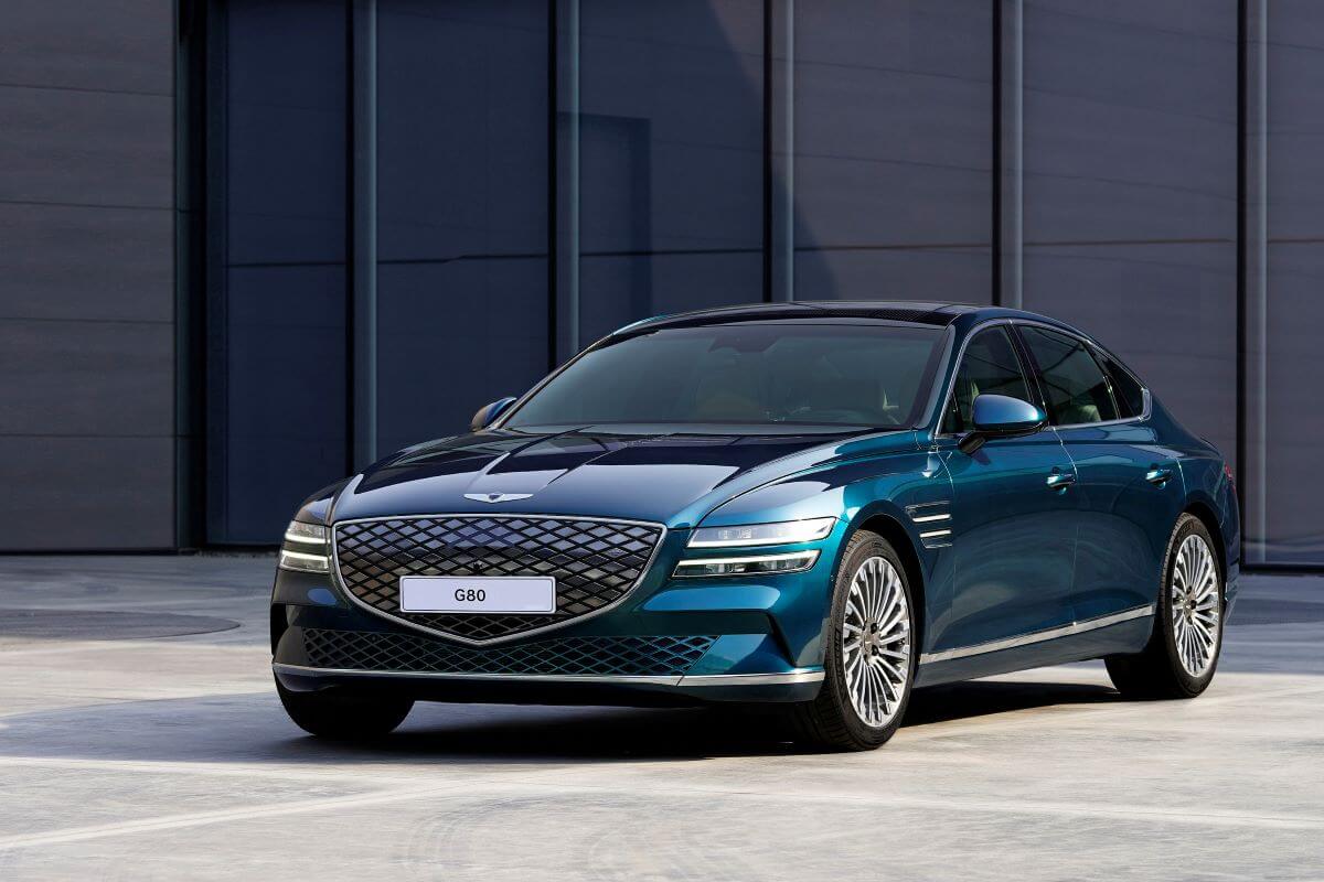 A blue-green Genesis Electrified G80 luxury sedan/executive car model