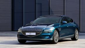 A blue-green Genesis Electrified G80 luxury sedan/executive car model
