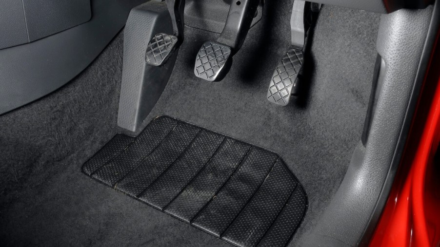 A car's clutch, gas, and brake pedals