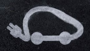 Road signage depicting an electric car visage seen in Paris, France