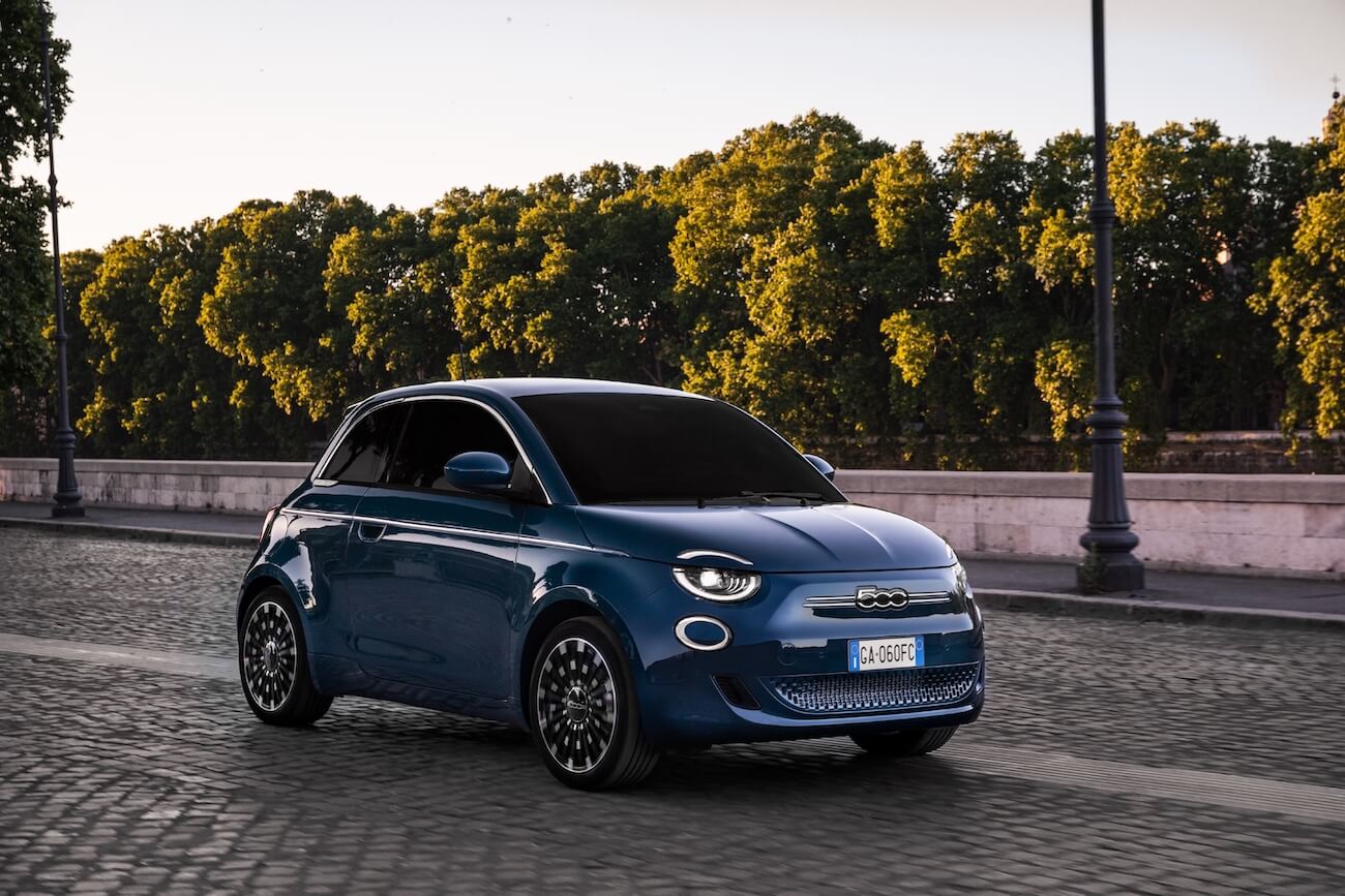A front angle view of the 2024 Fiat 500e car in blue, rather than grey
