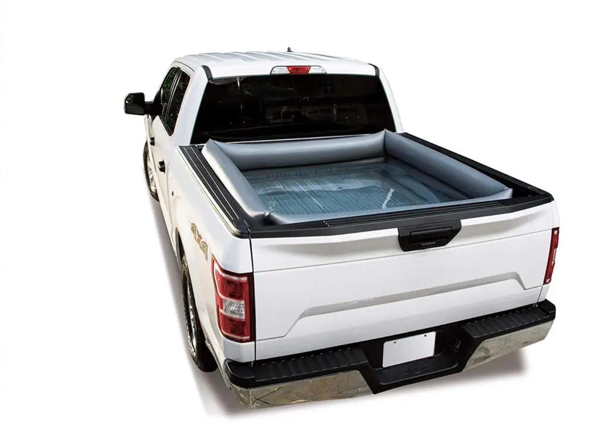 stock image of a white pickup truck with a pool in the bed.