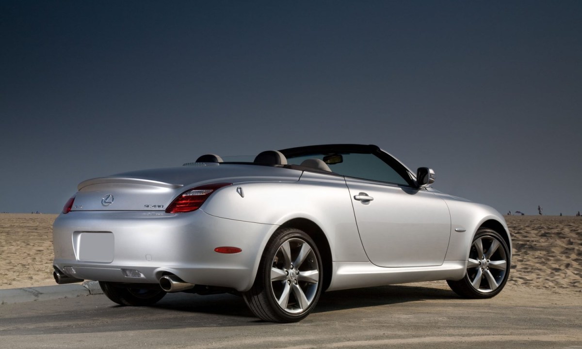 A silver Lexus SC430 parked with the top down