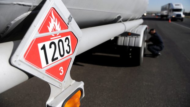 Why Do Some Semi-Truck Trailers Have a Red, Diamond-Shaped Sign?