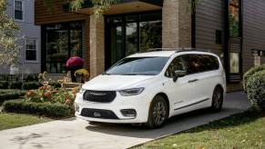 A white 2023 Chrysler Pacifica Road Tripper special edition parked on a home driveway