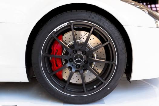 What Is the Red-Colored Auto Part Seen Inside the Tires of Certain Cars?