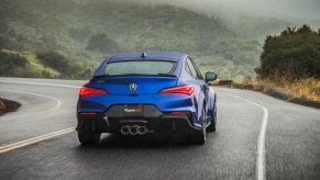 A rear view of a blue 2023 Acura Integra Type S