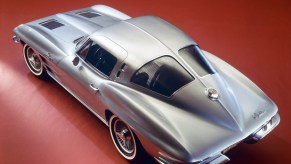 A silver 1963 Chevrolet Corvette C2 shows off its split window design.