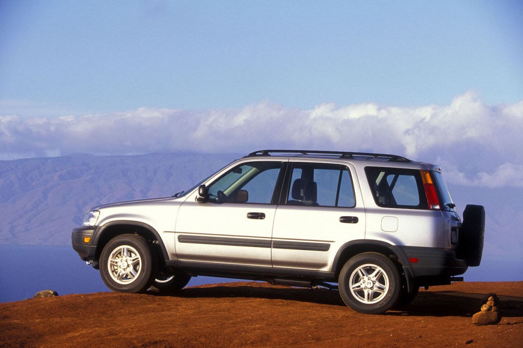 The original Honda CR-V from 1997, powered by the original CR-V engine, in silver overlooking a cliff.