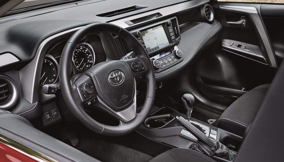 The black interior of a 2018 Toyota RAV4 Adventure compact SUV