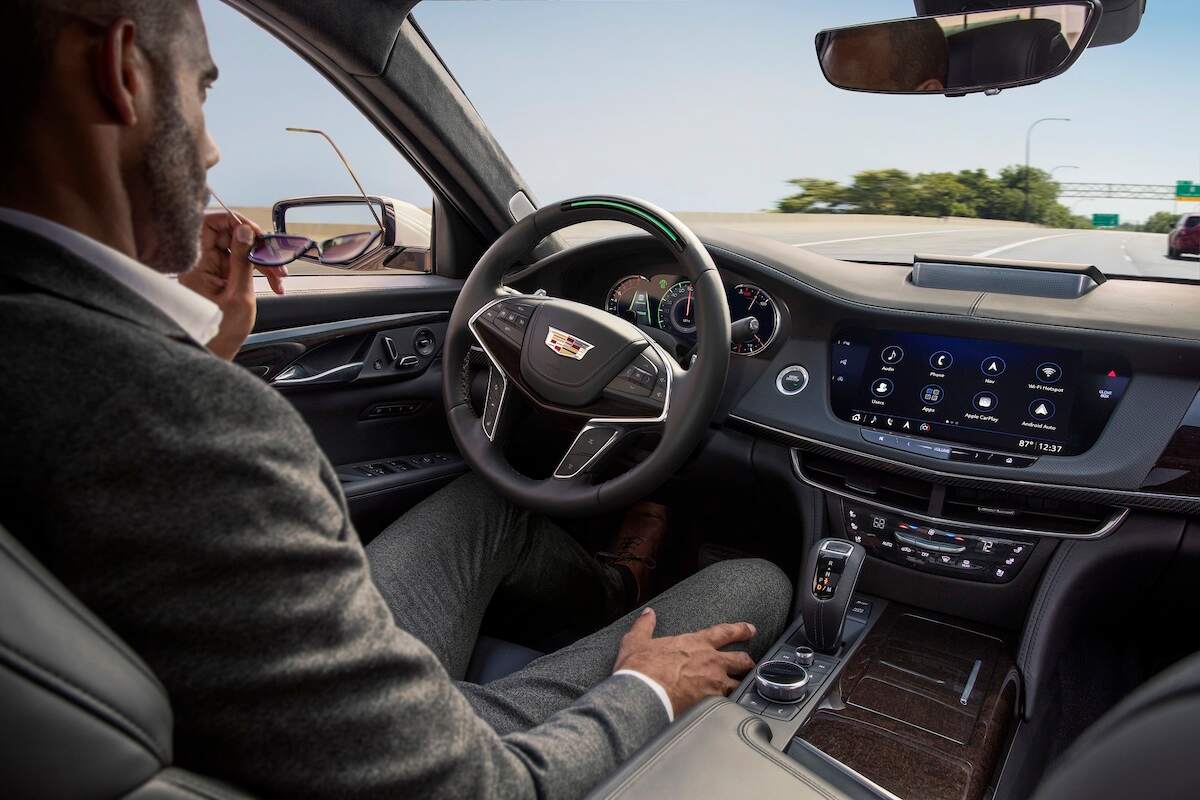 A man behind the steering wheel of a 2019 Cadillac CT6