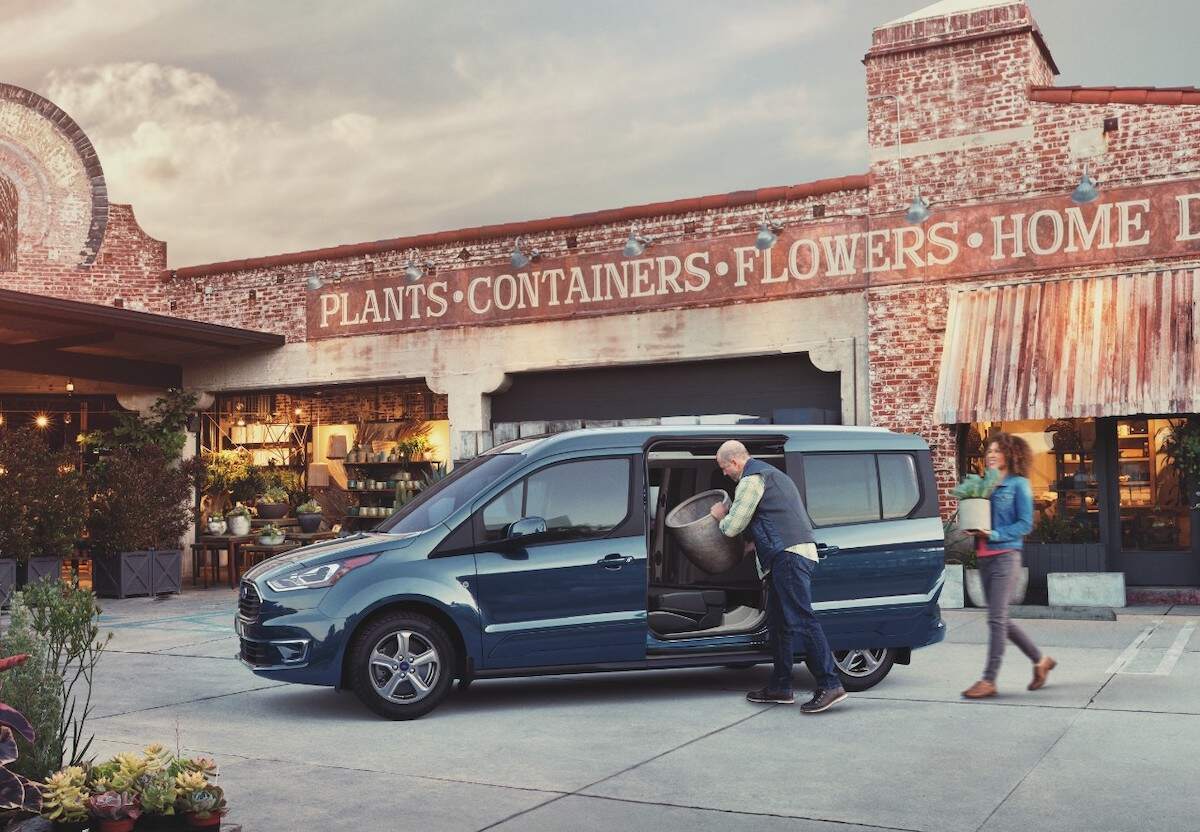 A 2021 Ford Transit Connect parked outside a garden store