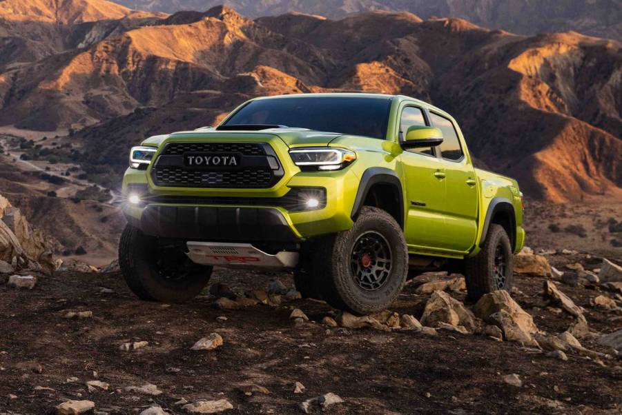 A 2022 Toyota Tacoma climbing over rocks.