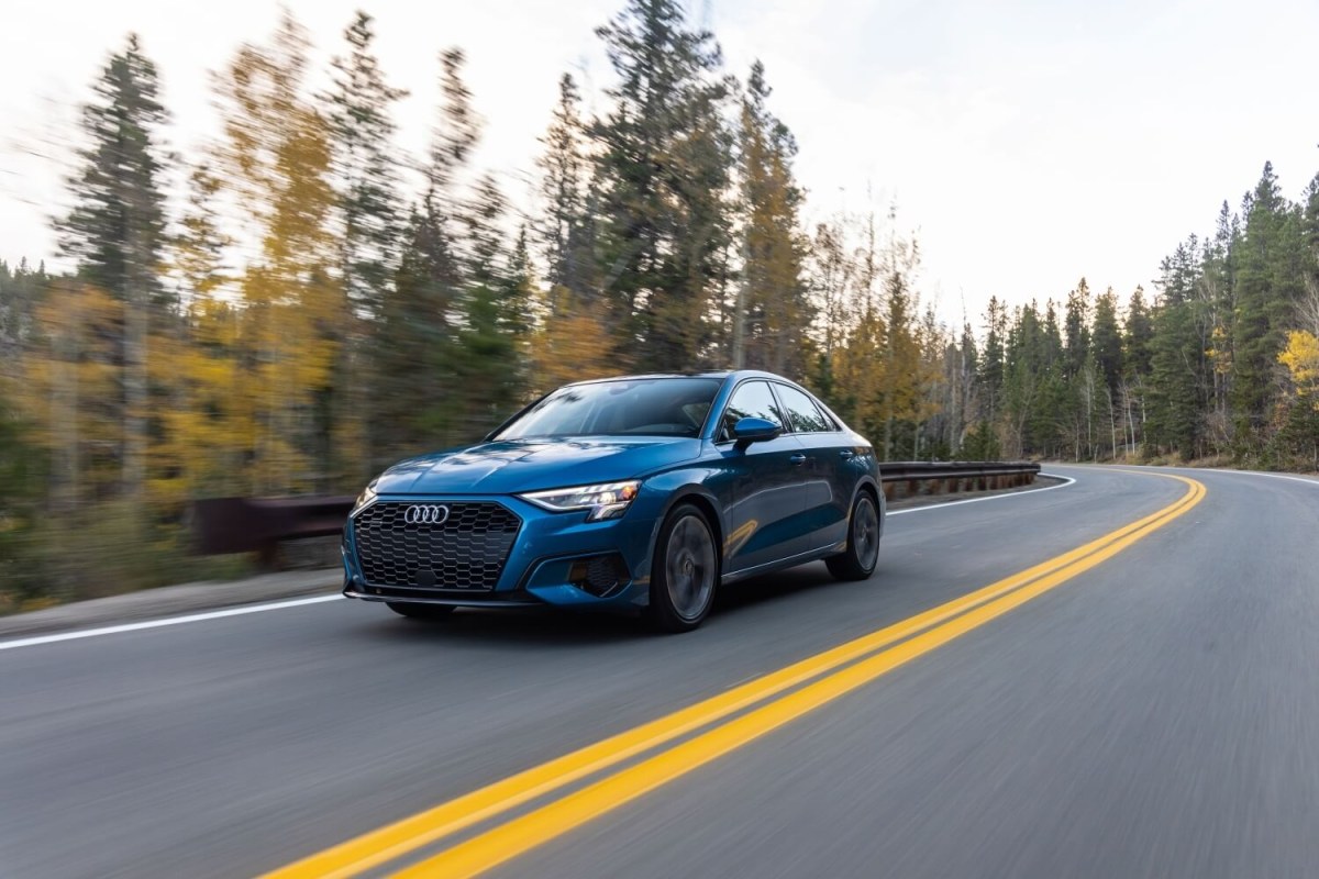 2023 Audi A3 in blue driving down a road