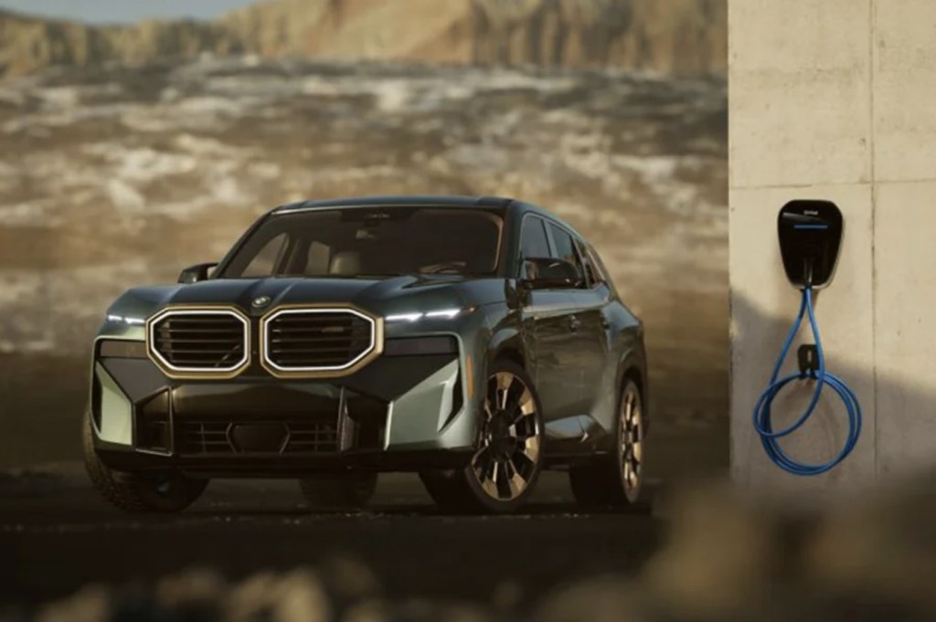 The 2023 BMW XM near a charging cable