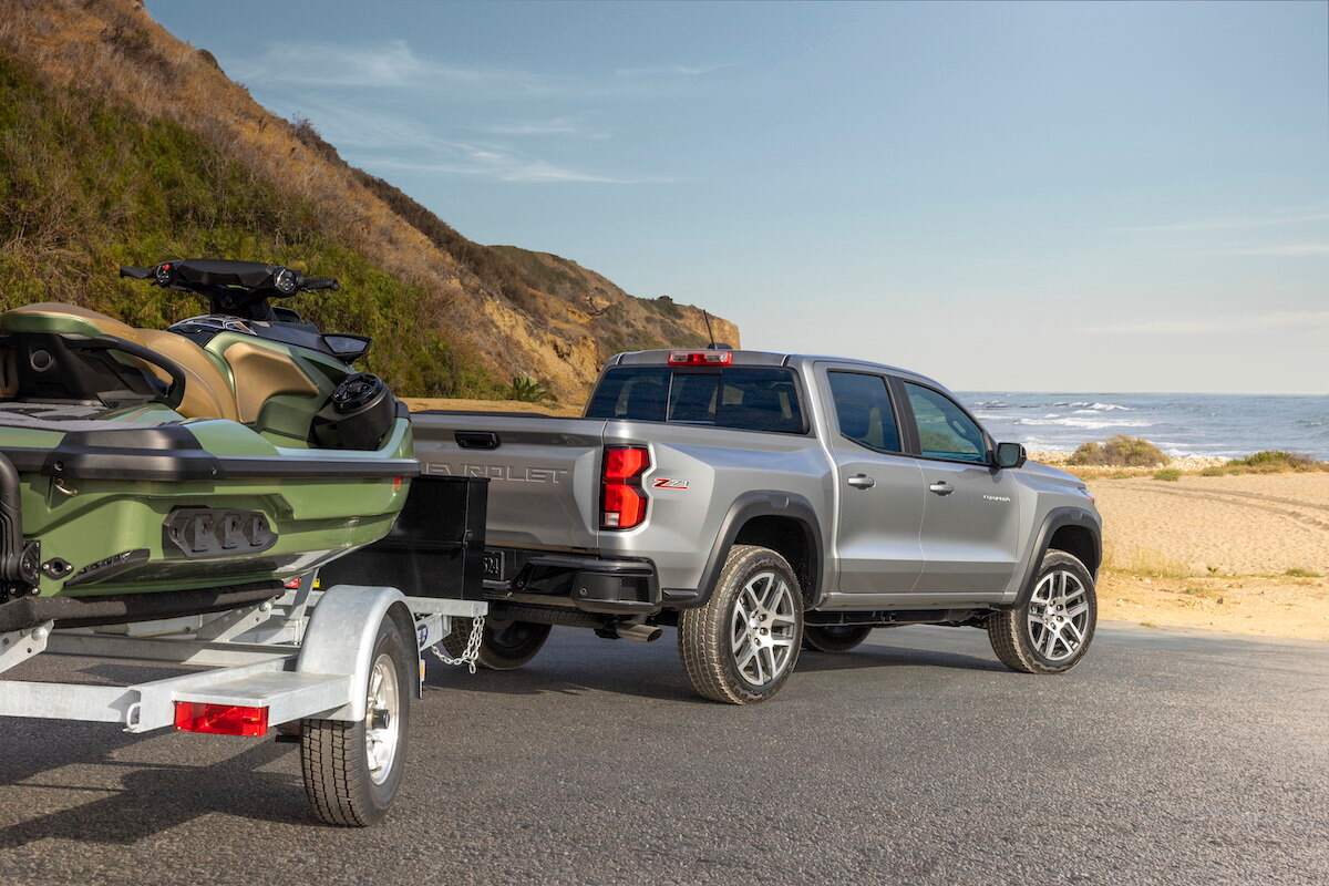 A 2023 Chevy Colorado Z71 towing a personal watercraft at a beach