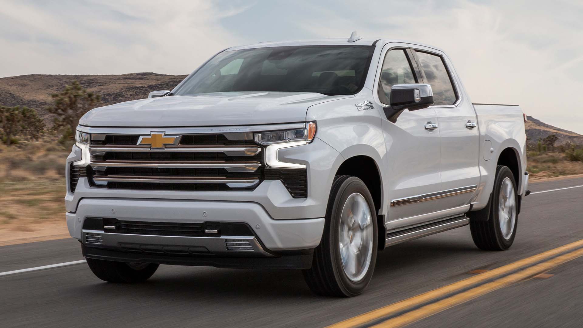 The 2023 Chevy Silverado driving on a country road