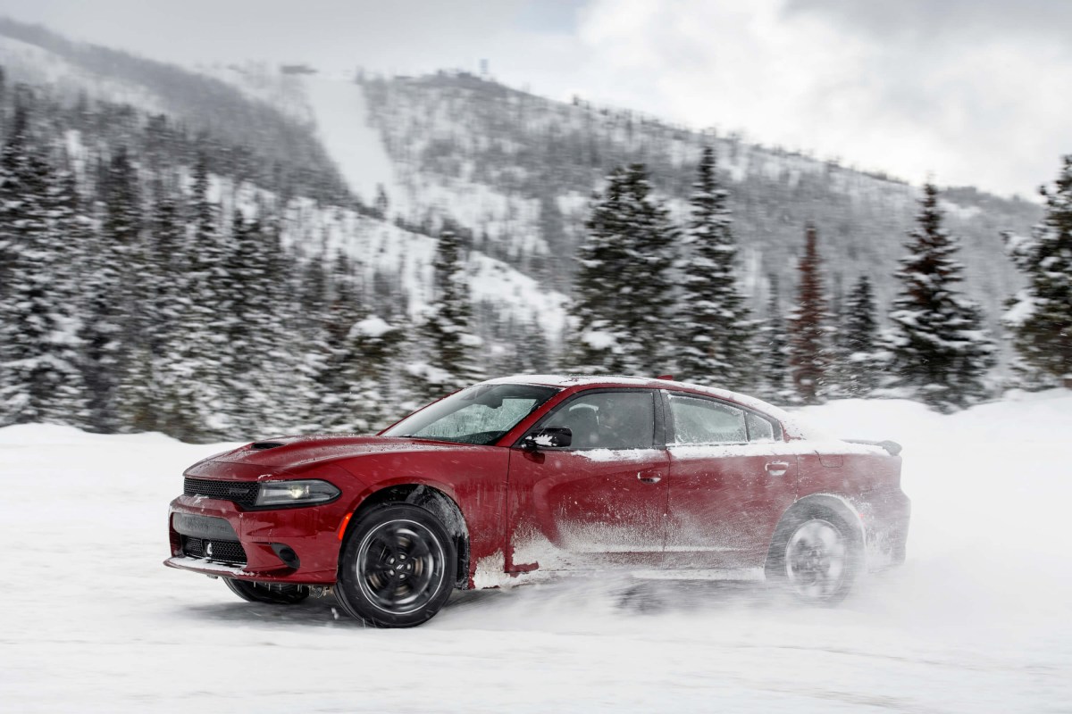 A 2023 Dodge Charger GT driving in the snow