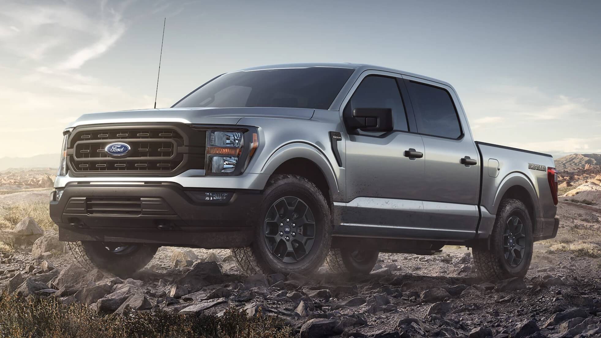 The 2023 Ford F-150 Rattler off-roading over rocks