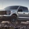 The 2023 Ford F-150 Rattler off-roading over rocks