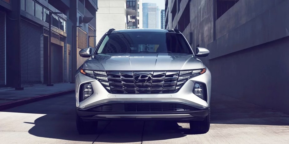 A gray 2023 Hyundai Tucson small SUV is parked. 