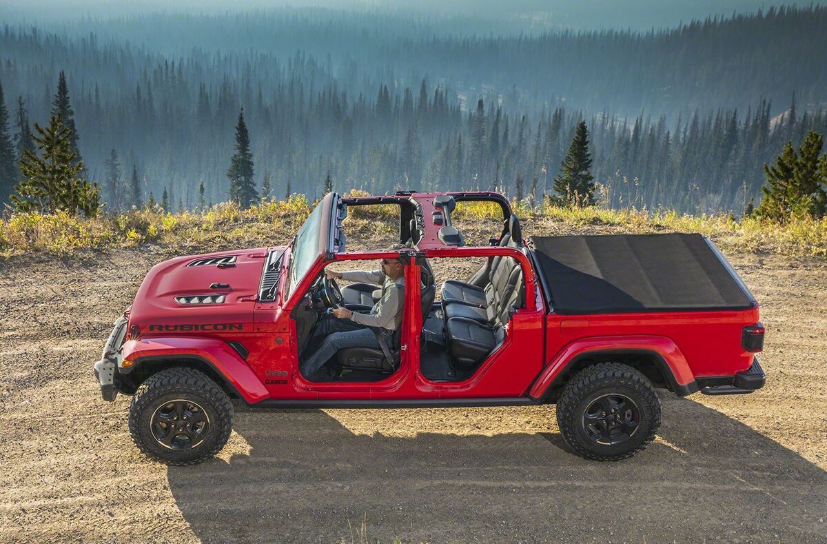 The 2023 Jeep Gladiator off-roading on a sandy trail