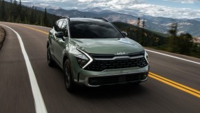 The 2023 Kia Sportage on a country road