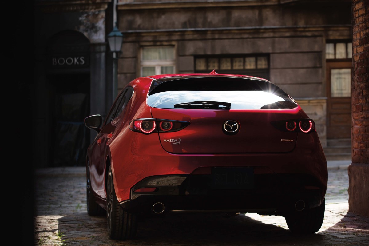 A rear view of the 2023 Mazda3 Turbo in red