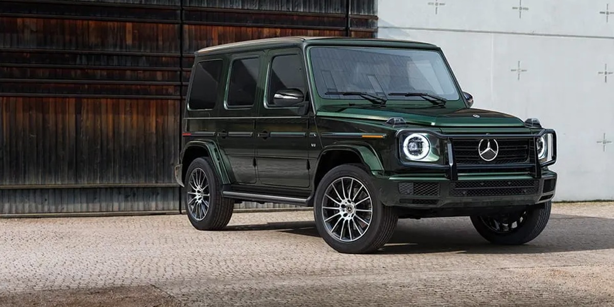 A green 2023 Mercedes-Benz G-Class is parked. 