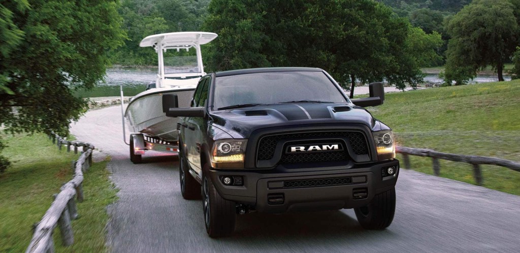 The 2023 Ram 1500 Classic towing a boat