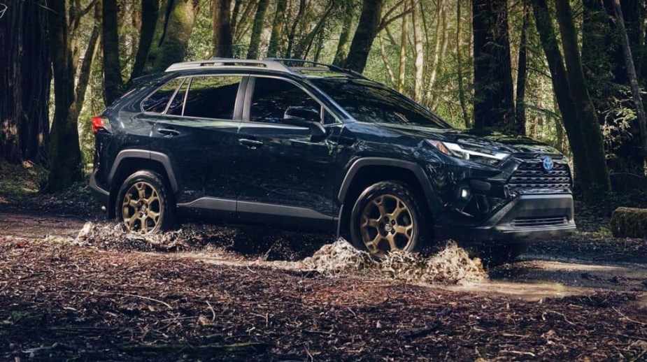 The 2023 Toyota RAV4 off-roading in water and mud
