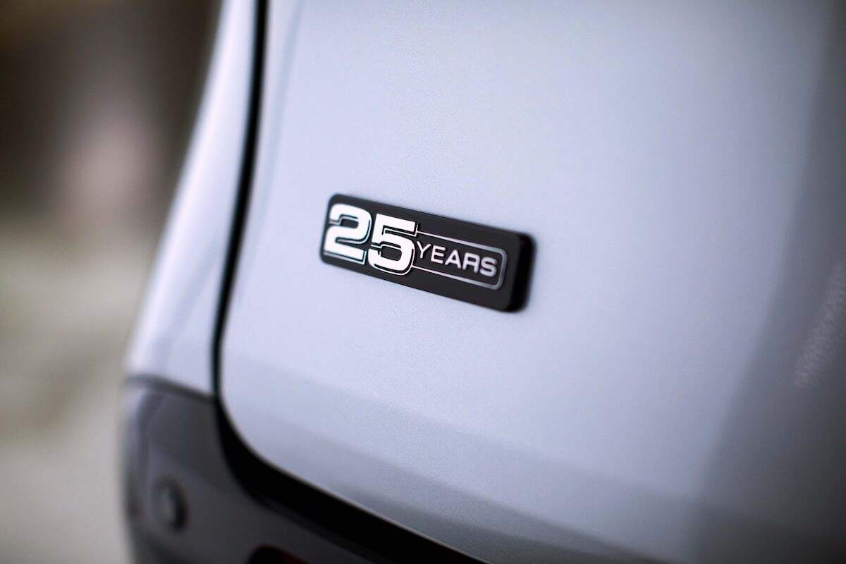 Close-up of a '25 Years' badge on a silver 2023 Toyota Sienna 25th Anniversary Special Edition minivan