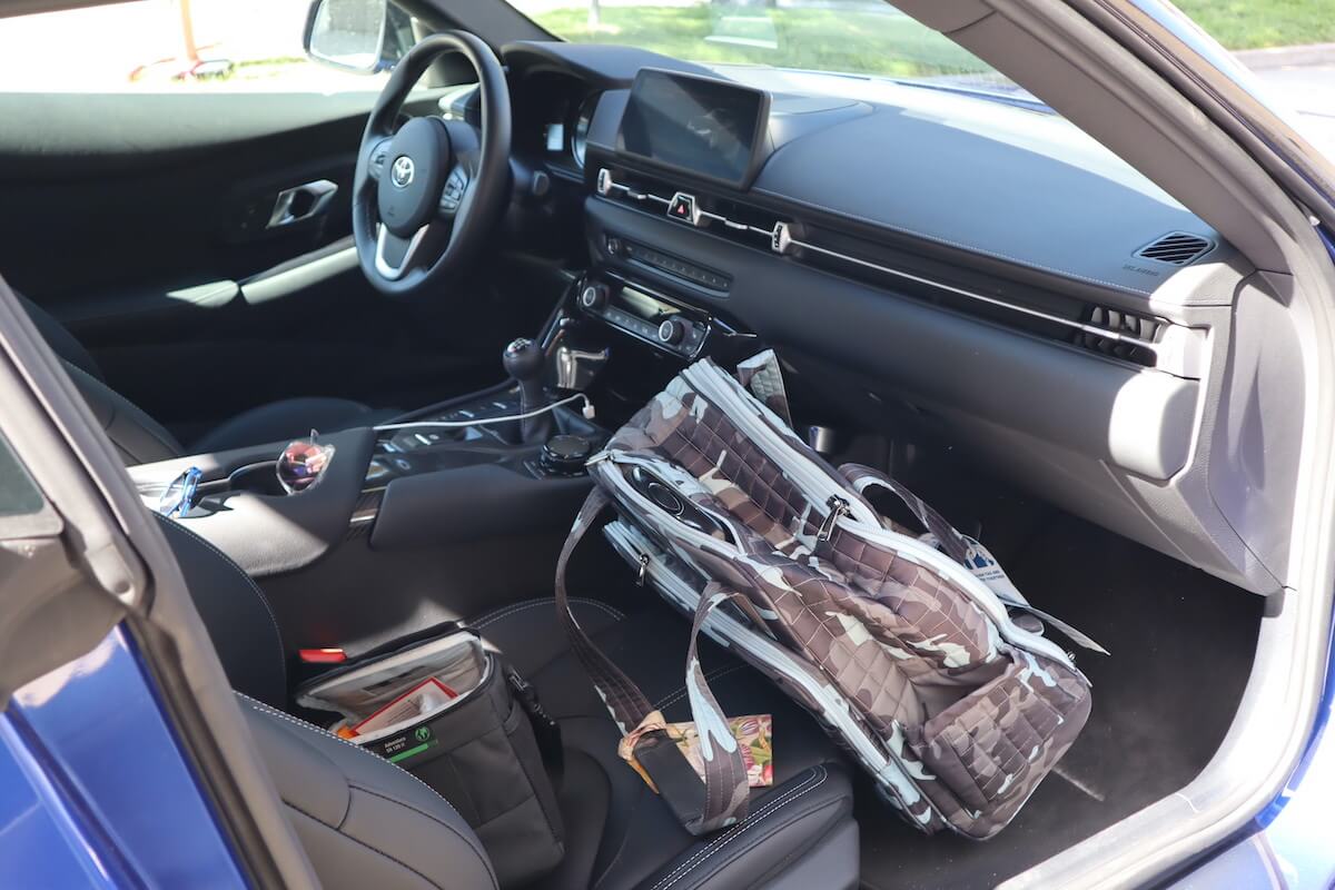 A suitcase in the front seat area in the 2023 Toyota Supra