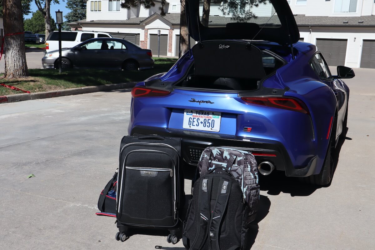 Suitcases outside the 2023 Toyota Supra