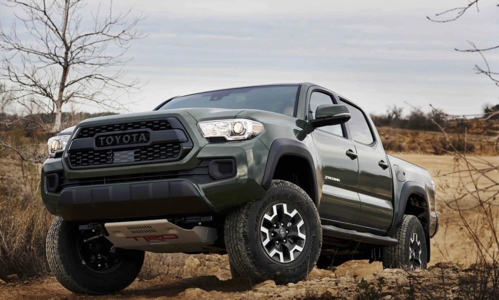 The 2023 Toyota Tacoma climning over rocks