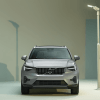 A promotional shot of a 2023 Volvo XC40 subcompact luxury SUV model illuminated by a white streetlight