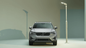A promotional shot of a 2023 Volvo XC40 subcompact luxury SUV model illuminated by a white streetlight