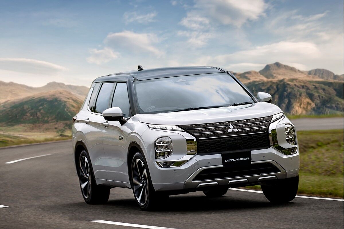 The 2023 Mitsubishi Outlander PHEV driving on the road