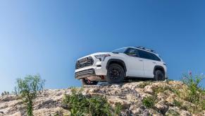 A white 2023 Toyota Sequoia TRD Pro on top of a rocky hill