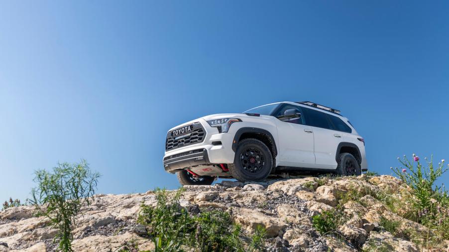 A white 2023 Toyota Sequoia TRD Pro on top of a rocky hill