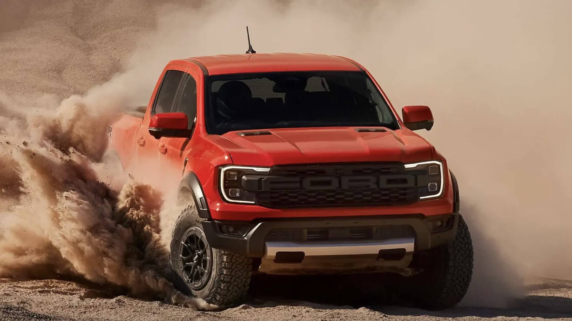 The 2024 Ford Ranger Raptor kicking up sand