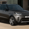 A 2024 Land Rover Discovery full-size luxury SUV model parked on a tan tile plaza