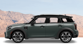A side profile banner shot of a Mini Countryman subcompact crossover SUV model with a background of orange hills